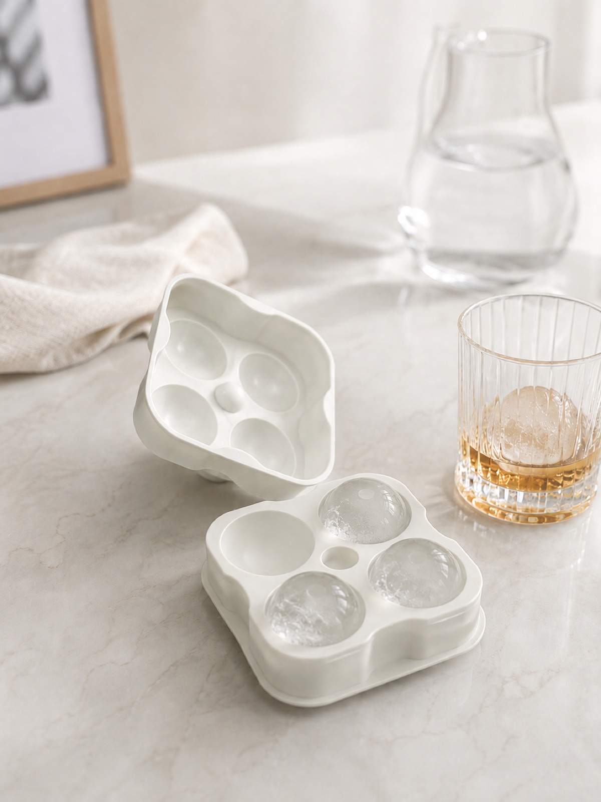 Preparing Four Round Ice Cubes Before Guests Arrive